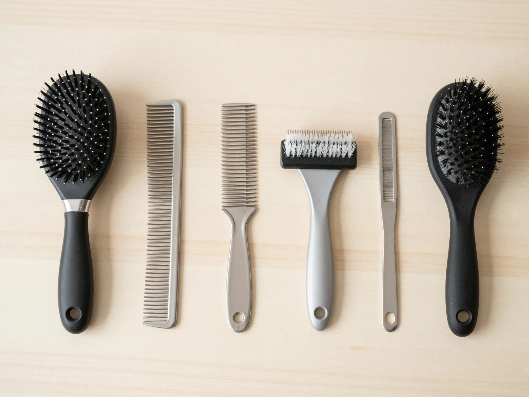 Array professional longhair cat grooming tools flat lay